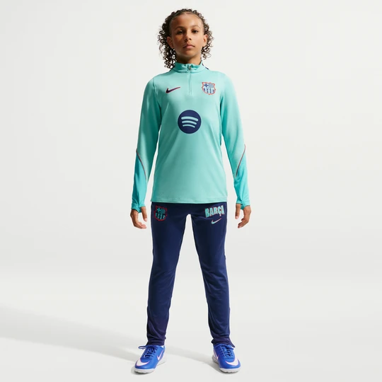 Zdjęcie produktu Dzianinowe spodnie piłkarskie dla dużych dzieci Nike Dri-FIT FC Barcelona Strike (wersja trzecia) - Niebieski