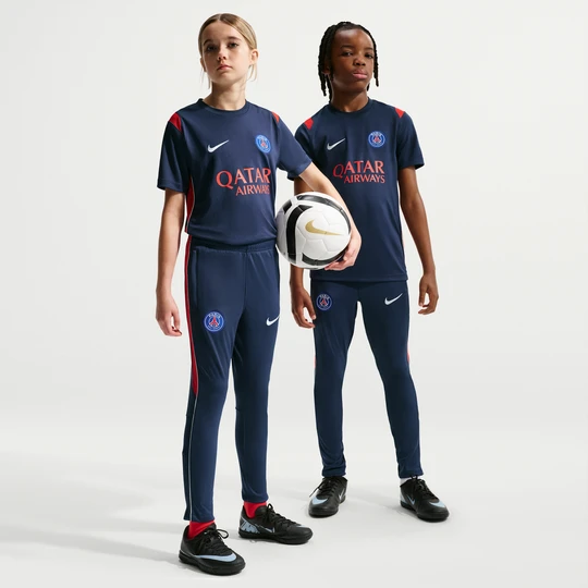 Zdjęcie produktu Dzianinowe spodnie piłkarskie dla dużych dzieci Nike Dri-FIT Paris Saint-Germain Academy Pro - Niebieski