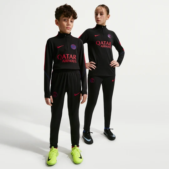 Zdjęcie produktu Dzianinowe spodnie piłkarskie dla dużych dzieci Nike Dri-FIT Paris Saint-Germain Strike - Czerń