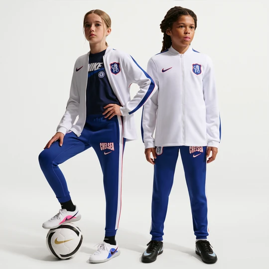 Zdjęcie produktu Dzianinowy dres piłkarski dla dużych dzieci Nike Dri-FIT Chelsea FC Strike (wersja trzecia) - Biel