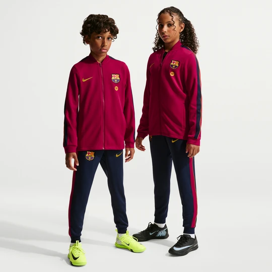 Zdjęcie produktu Dzianinowy dres piłkarski dla dużych dzieci Nike Dri-FIT FC Barcelona Strike - Czerwony