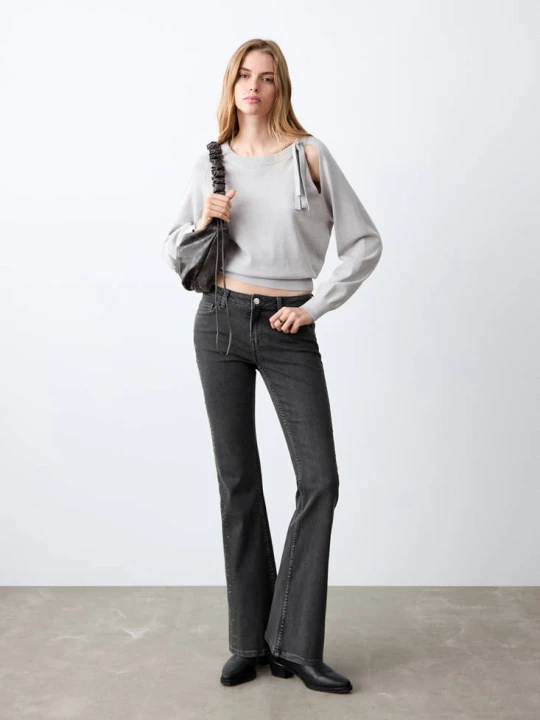 Zdjęcie produktu Dżinsy o kroju flare ze strasem black denim - Teen - MANGO TEEN