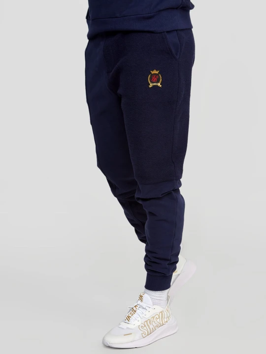 Zdjęcie produktu Granatowe spodnie dresowe męskie z odwróconym szyciem SikSilk