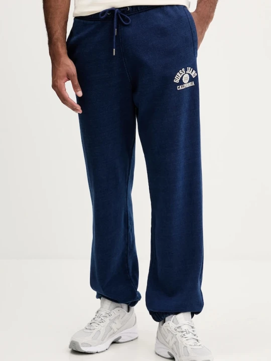 Zdjęcie produktu Guess Jeans spodnie dresowe bawełniane niebieski