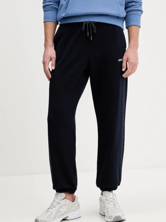 Zdjęcie produktu Guess Jeans spodnie dresowe bawełniane granatowy