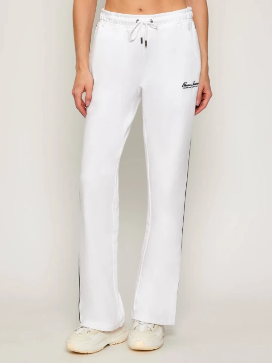 Zdjęcie produktu Guess Jeans Spodnie dresowe | flare fit biały