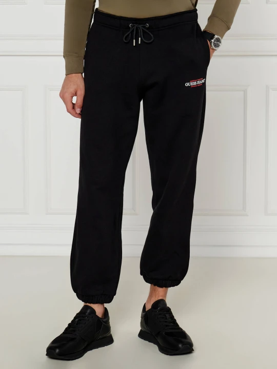 Zdjęcie produktu Guess Jeans Spodnie dresowe | Regular Fit czarny