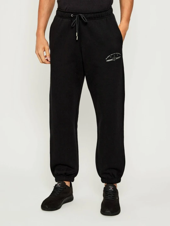Zdjęcie produktu Guess Jeans Spodnie dresowe | Relaxed fit czarny