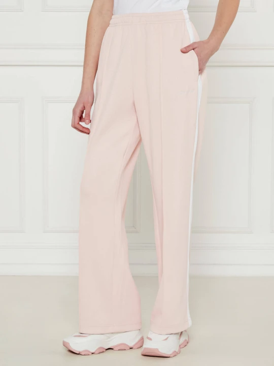 Zdjęcie produktu Guess Jeans Spodnie dresowe TRICOT | Relaxed fit pudrowy róż