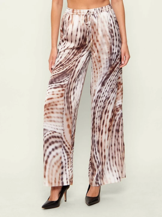 Zdjęcie produktu GUESS Satynowe spodnie INES | flare fit beżowy