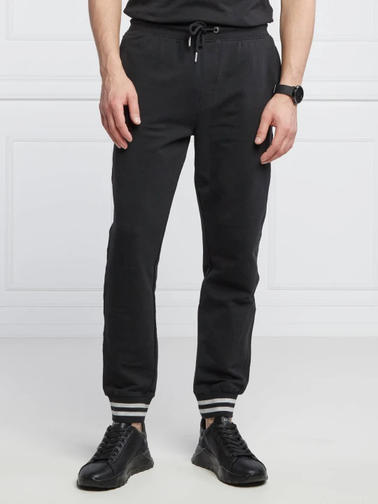 Zdjęcie produktu GUESS Spodnie dresowe Adam | Relaxed fit czarny