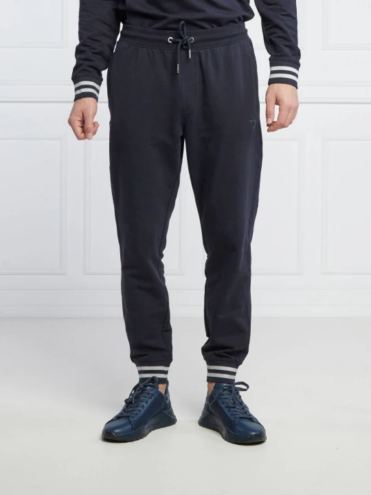 Zdjęcie produktu GUESS Spodnie dresowe Adam | Relaxed fit granatowy