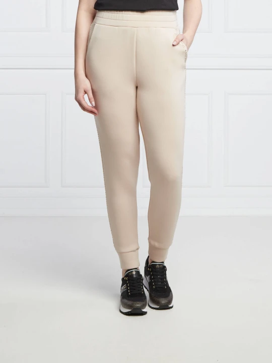 Zdjęcie produktu GUESS Spodnie dresowe SIMONNE | Regular Fit kremowy