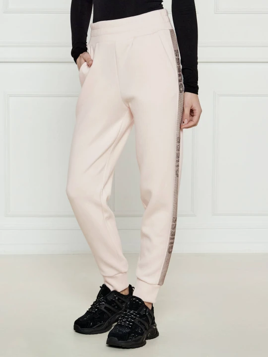 Zdjęcie produktu GUESS Spodnie dresowe Victoire | Regular Fit pudrowy róż