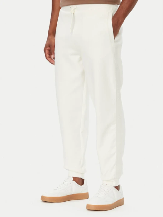 Zdjęcie produktu Guess Spodnie dresowe Z6YB13 K4965 Kremowy Regular Fit
