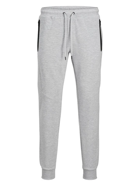 Zdjęcie produktu Jack & Jones Spodnie dresowe "Will" w kolorze jasnoszarym rozmiar: XXL