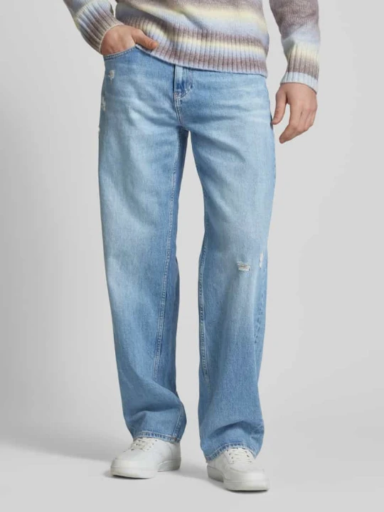 Zdjęcie produktu Jeansy o kroju relaxed straight fit z przetarciami model ‘JAIMIE’ Tommy Jeans Jasnoniebieski