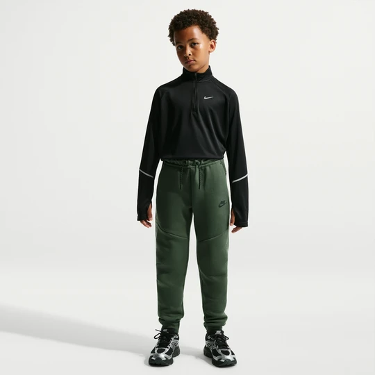 Zdjęcie produktu Joggery z akcentami o designie odbijającym światło dla dużych dzieci Nike Tech Fleece - Zieleń