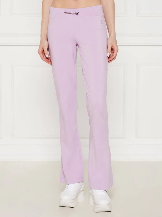 Zdjęcie produktu Juicy Couture Spodnie dresowe | flare fit | low rise lawendowy