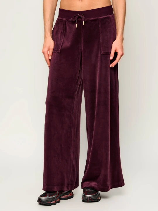 Zdjęcie produktu Juicy Couture Spodnie dresowe Yuka | Loose fit | mid rise bordowy