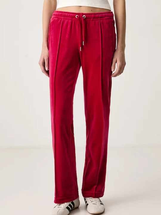 Zdjęcie produktu Juicy Couture spodnie flare damskie welurowe TINA TRACK PANT czerwony