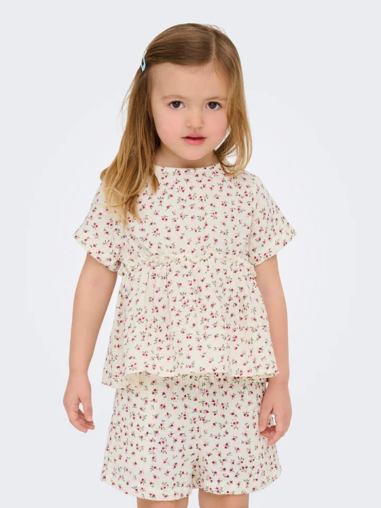 Zdjęcie produktu KIDS ONLY Kombinezon "Thyra" w kolorze kremowym rozmiar: 122