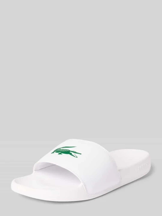 Zdjęcie produktu Klapki basenowe z nadruk z logo model 'SERVE SLIDE' Lacoste Biały