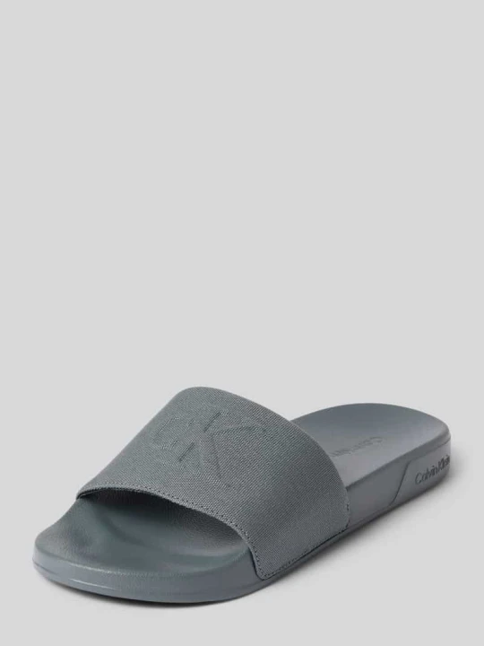 Zdjęcie produktu Klapki kąpielowe z detal z logo Calvin Klein Jasnoszary