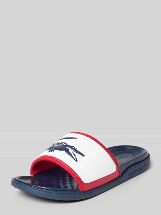 Zdjęcie produktu Klapki kąpielowe z nadrukiem z logo model 'SERVE SLIDE 1.0 ' Lacoste Biały