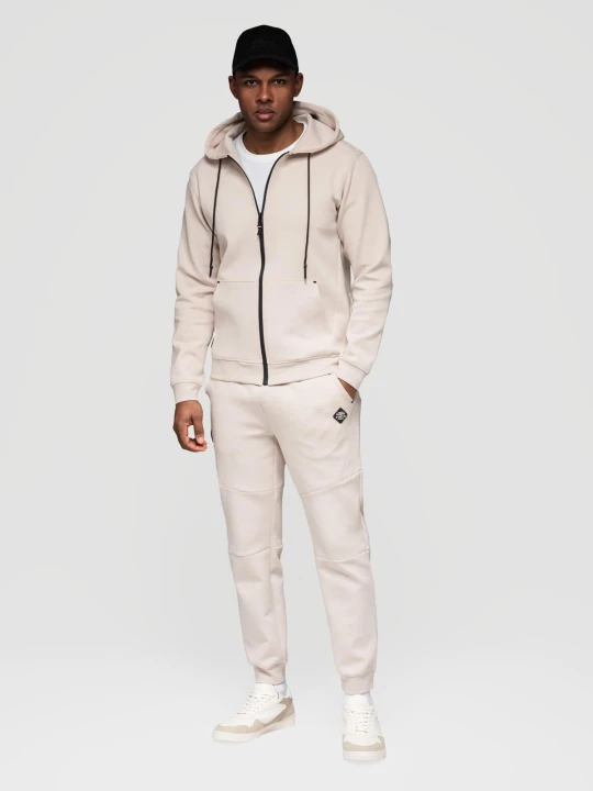 Zdjęcie produktu Komplet dresowy męski set bluza rozpinana z kapturem + spodnie joggery - jasnobeżowy V6 - Rozmiar: XL Ombre Clothing