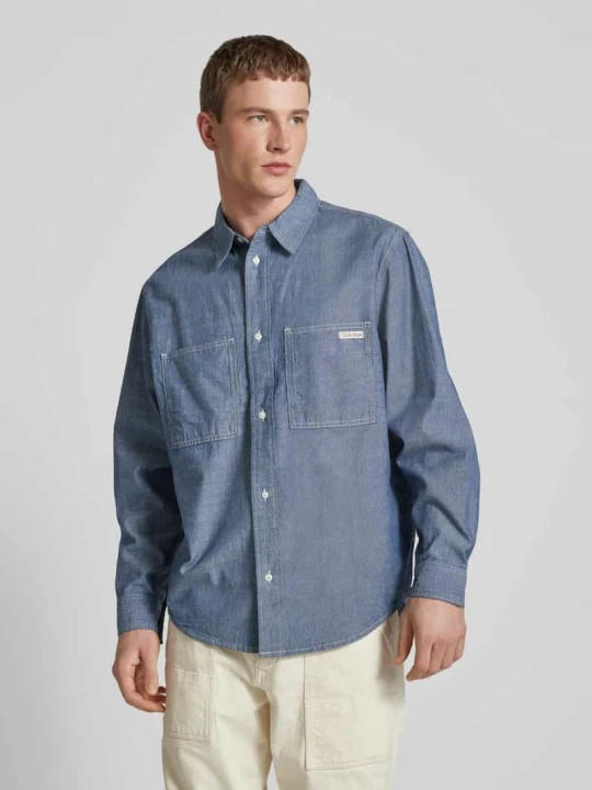 Zdjęcie produktu Koszula jeansowa o kroju regular fit z detalem z logo model ‘EASY CHAMBRAY’ Calvin Klein Jeans Jeansowy niebieski