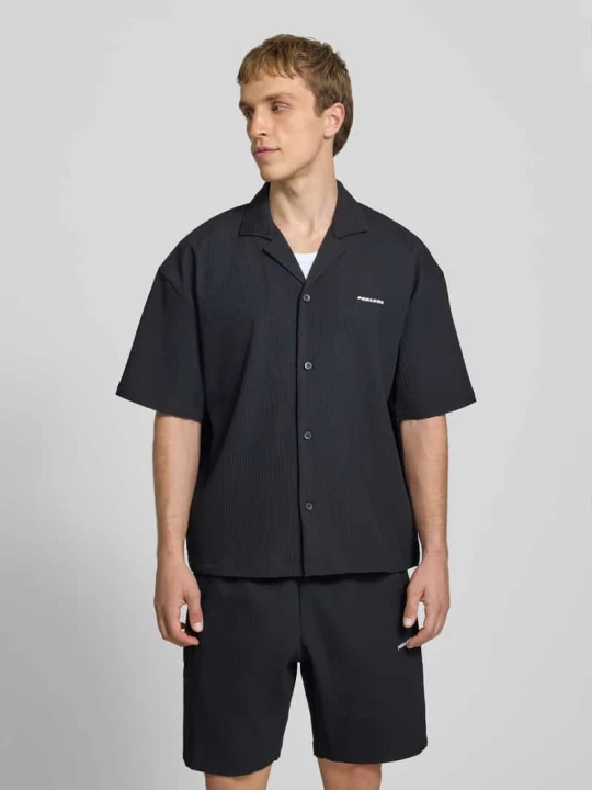 Zdjęcie produktu Koszula casualowa o kroju relaxed fit z kołnierzem z połami model 'Troy' Pegador Czarny