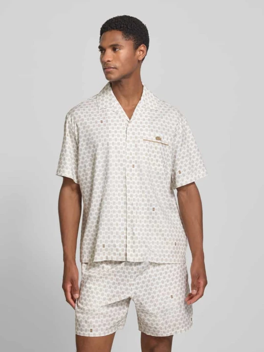 Zdjęcie produktu Koszula casualowa o kroju relaxed fit z mieszanki bawełny model 'Tennisco' Lacoste Złamany biały