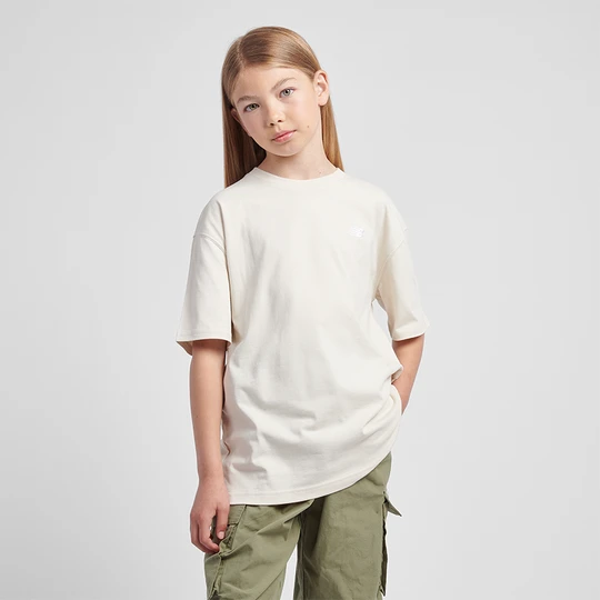 Zdjęcie produktu Koszulka dziecięca New Balance LAKG0001LIN – beżowa