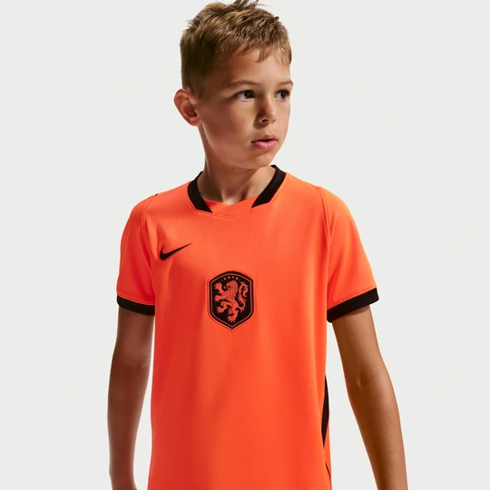 Zdjęcie produktu Koszulka piłkarska dla dużych dzieci Nike Dri-FIT reprezentacja Holandii Stadium 2026 (wersja domowa) - Pomarańczowy