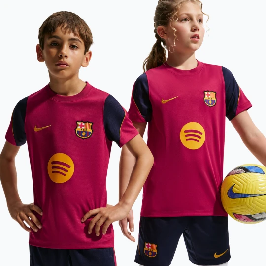 Zdjęcie produktu Koszulka piłkarska dziecięca Nike FC Barcelona Strike Dri-Fit noble red/blackened blue