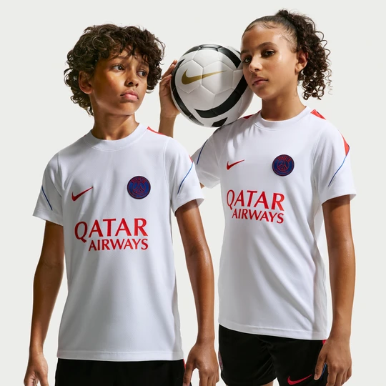 Zdjęcie produktu Koszulka piłkarska z krótkim rękawem dla dużych dzieci Nike Dri-FIT Paris Saint-Germain Strike - Biel