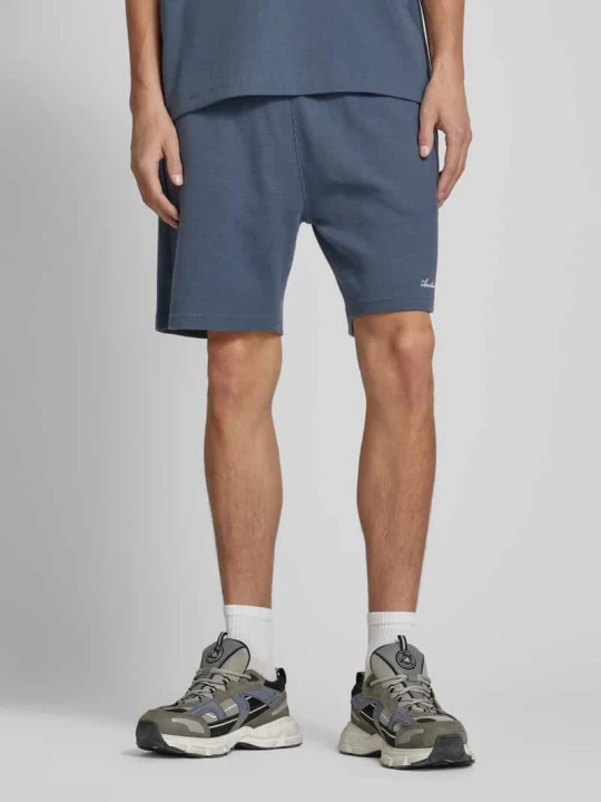 Zdjęcie produktu Koszulka polo o kroju oversized z nadrukiem z logo Another Cotton Lab Ciemnoniebieski