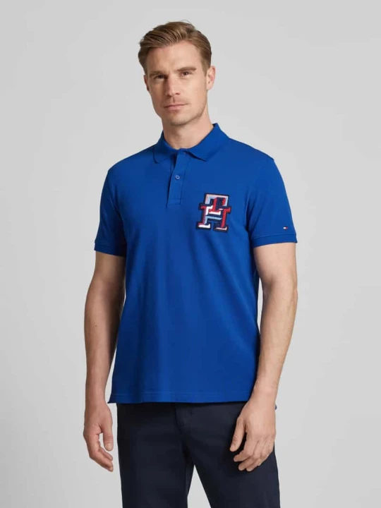 Zdjęcie produktu Koszulka polo o kroju regular fit z naszywką z logo Tommy Hilfiger Królewski niebieski