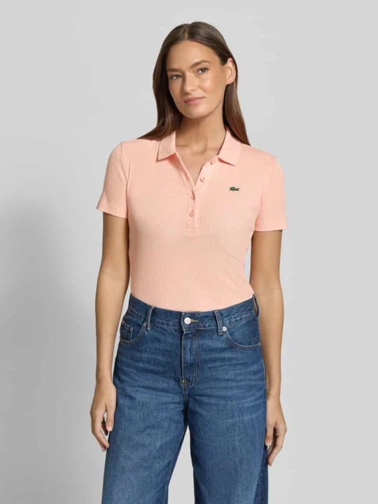 Zdjęcie produktu Koszulka polo o kroju slim fit z czystej bawełny Lacoste Morelowy