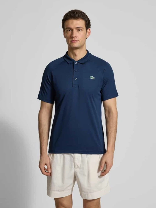 Zdjęcie produktu Koszulka polo sportowa w kroju regular fit z naszywką z logo Lacoste Ciemnoniebieski