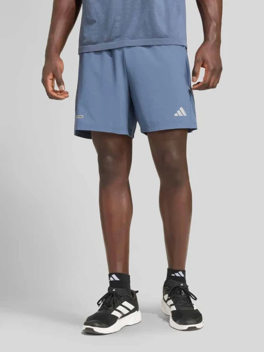 Zdjęcie produktu Koszulka z nadrukiem logo, krój regular fit Adidas Ciemnoniebieski