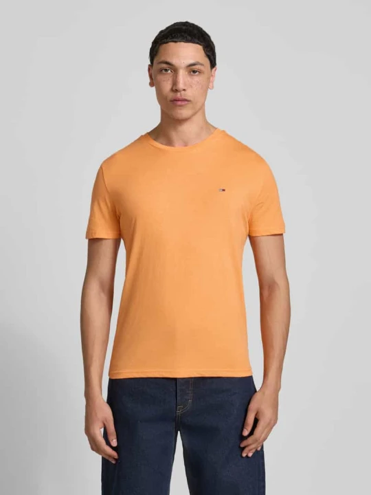 Zdjęcie produktu krój slim fit t-shirt model 'TJM XSLIM JASPE HTR TEE E' Tommy Jeans Pomarańczowy melanż