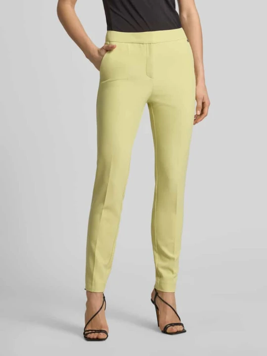 Zdjęcie produktu krój slim fit Wąskie spodnie z nitami z LOGO model 'HAGONIA-1' Hugo Jasnozielony