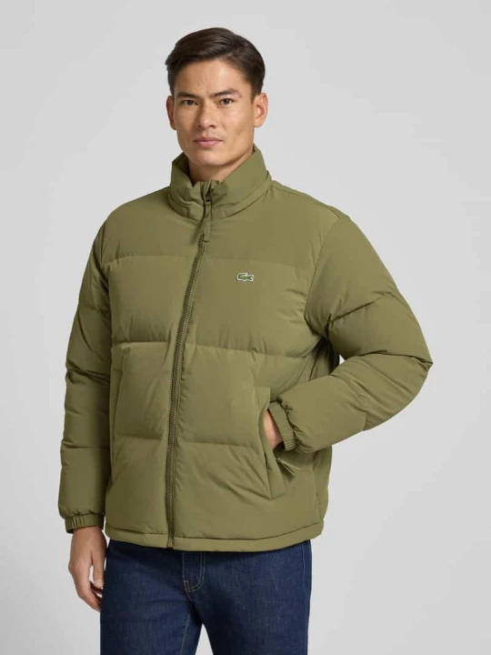 Zdjęcie produktu Kurtka puchowa o kroju regular fit ze stójką i zintegrowanym kapturem Lacoste Oliwkowy