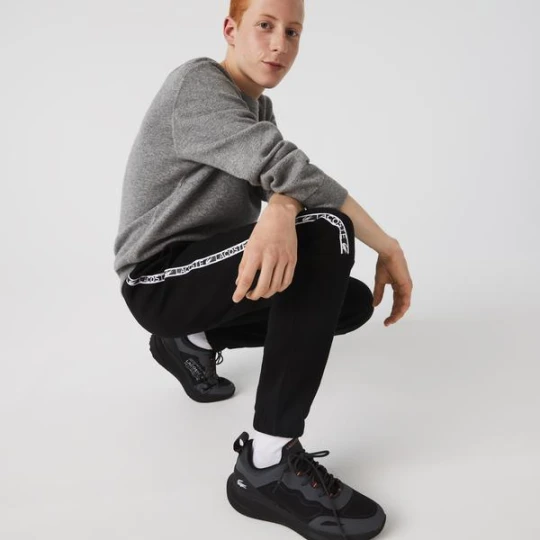 Zdjęcie produktu Lacoste męskie spodnie sportowe z lampasami z nadrukiem