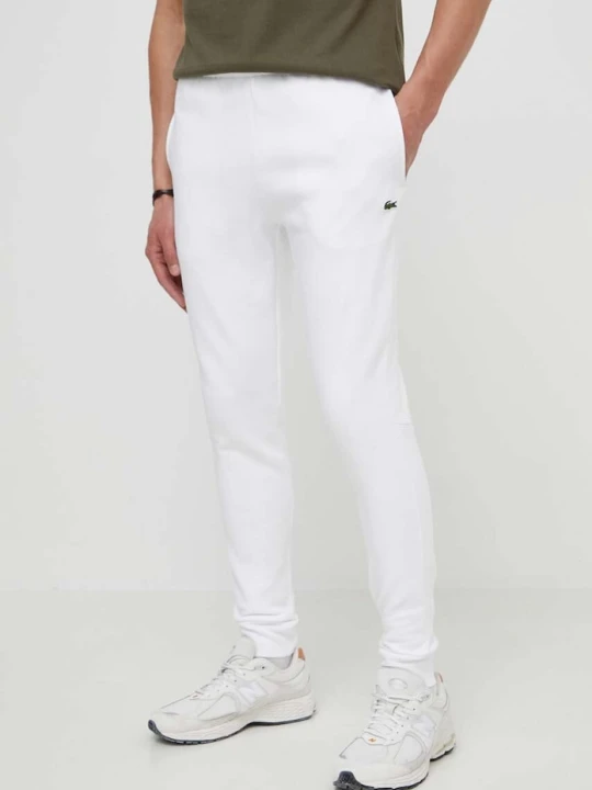 Zdjęcie produktu Lacoste spodnie dresowe męskie z bawełną biały