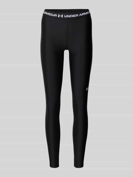 Zdjęcie produktu legginsy o kroju slim fit do sportu z elastycznym pasem model 'HeatGear' Under Armour Czarny