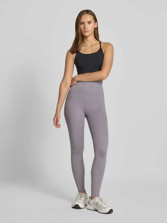 Zdjęcie produktu legginsy o kroju slim fit z nadrukiem z logo model 'Harmony' New Balance Średnioszary