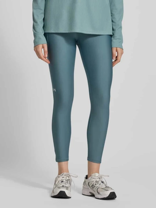 Zdjęcie produktu Legginsy o kroju slim fit z nadrukiem z logo model ‘Tech’ Under Armour Miętowy